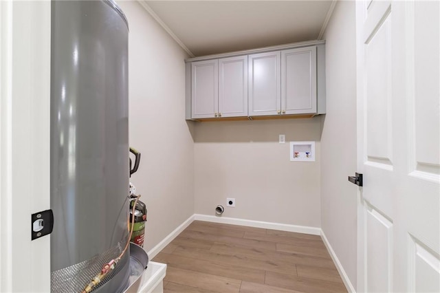 washroom featuring electric dryer hookup, cabinets, crown molding, washer hookup, and light hardwood / wood-style floors