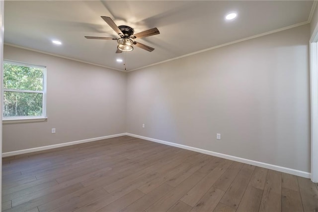 unfurnished room featuring hardwood / wood-style flooring, ceiling fan, and ornamental molding