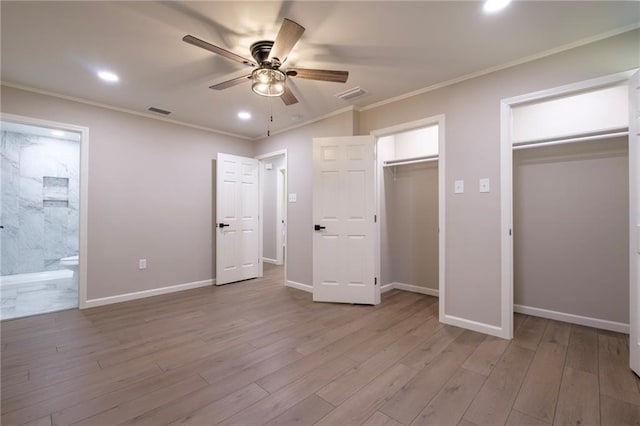 unfurnished bedroom featuring two closets, light hardwood / wood-style flooring, ceiling fan, and ornamental molding