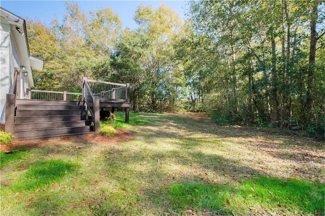 view of yard with a wooden deck