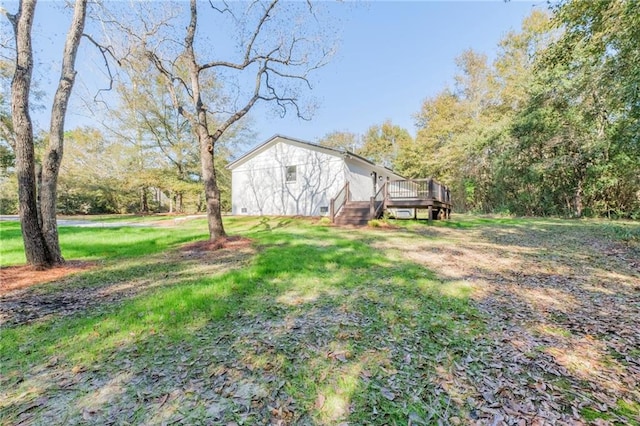 view of yard featuring a wooden deck