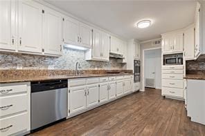 kitchen featuring a sink, white cabinetry, dark wood-style floors, under cabinet range hood, and stainless steel appliances
