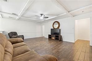 living room with coffered ceiling, beamed ceiling, wood finished floors, and ceiling fan