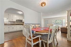 dining space with dark wood-style floors