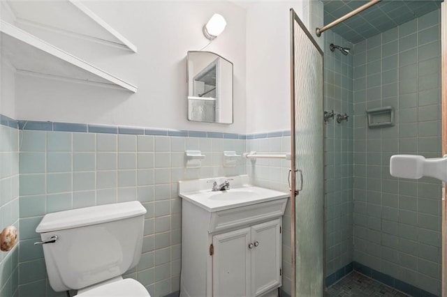 2950 Pinetucky Rd, Mobile, AL 36618 - bathroom with a stall shower, toilet, tile walls, wainscoting, and vanity
