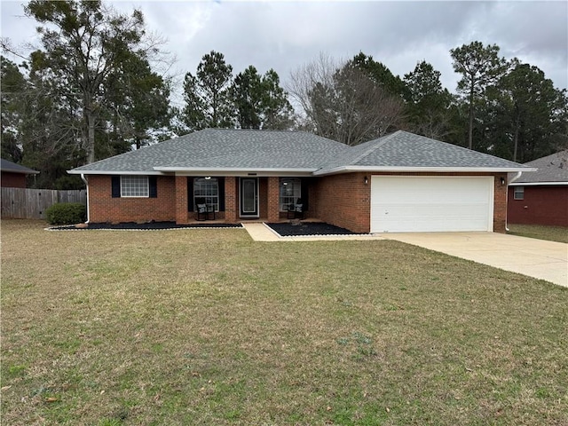 single story home with a garage and a front lawn