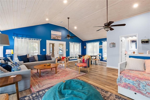 living room with wooden ceiling, a healthy amount of sunlight, french doors, and wood finished floors