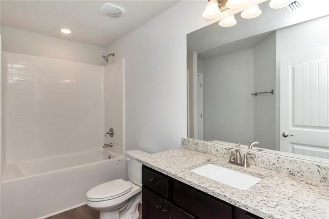 full bath with toilet, visible vents,  shower combination, and vanity