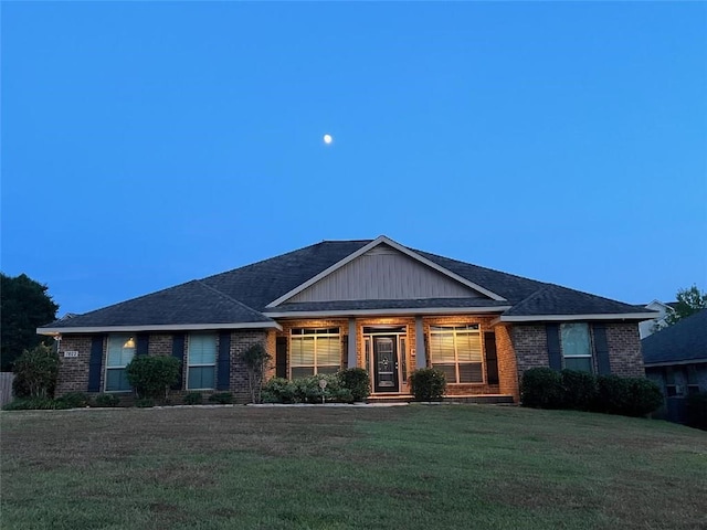 ranch-style house with a lawn