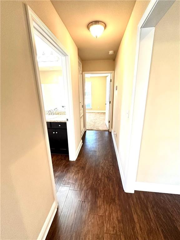 hallway with dark hardwood / wood-style floors