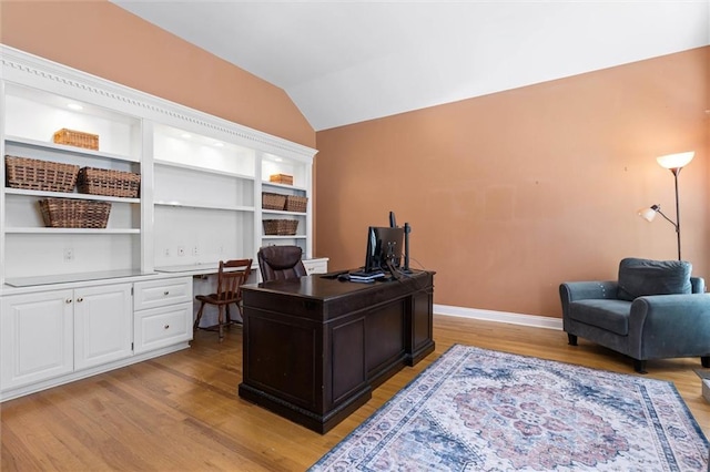 704 Providence Estates Dr E, Mobile, AL 36695 - office area with light wood-style flooring, vaulted ceiling, baseboards, and built in desk