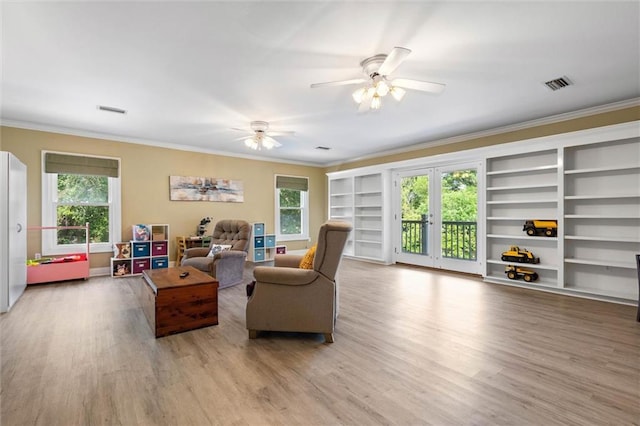704 Providence Estates Dr E, Mobile, AL 36695 - living room with ornamental molding, wood finished floors, plenty of natural light, a ceiling fan, and built in features