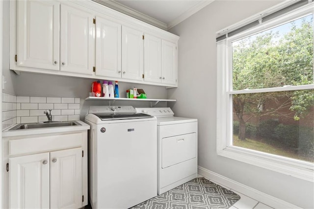 704 Providence Estates Dr E, Mobile, AL 36695 - laundry area featuring washer and clothes dryer, cabinet space, crown molding, and baseboards