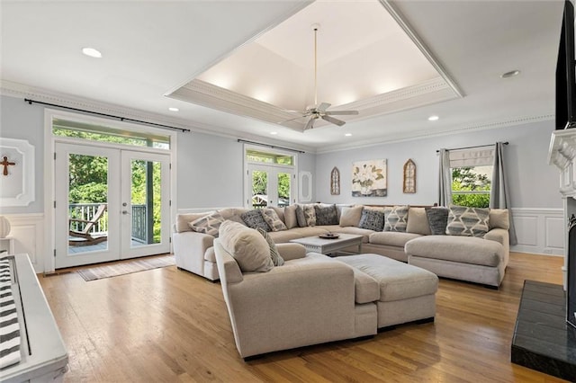 704 Providence Estates Dr E, Mobile, AL 36695 - living area featuring french doors, crown molding, healthy amount of natural light, a wainscoted wall, and a raised ceiling