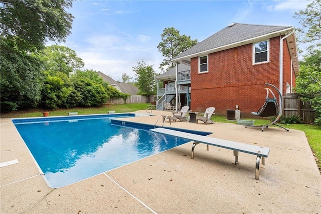 704 Providence Estates Dr E, Mobile, AL 36695 - view of swimming pool with a diving board, stairway, a fenced backyard, a patio, and central AC