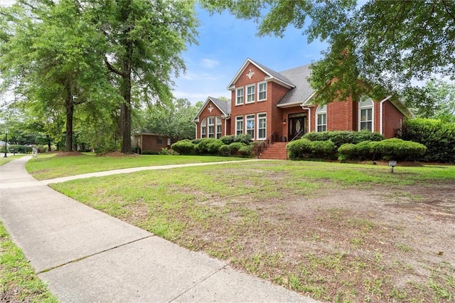 704 Providence Estates Dr E, Mobile, AL 36695 - traditional-style home with brick siding and a front yard
