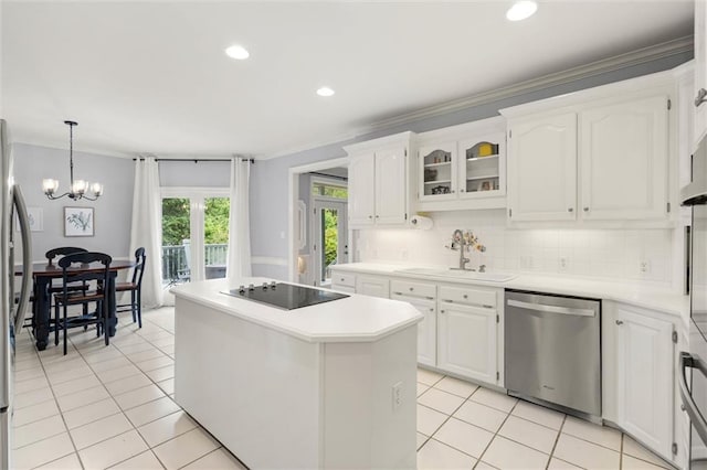 704 Providence Estates Dr E, Mobile, AL 36695 - kitchen featuring stainless steel dishwasher, a sink, black electric stovetop, a kitchen island, and ornamental molding