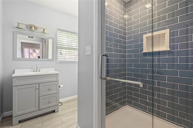 42 Lourando Dr W, Mobile, AL 36606 - full bath featuring vanity, wood finished floors, and a shower stall