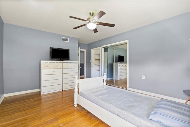 42 Lourando Dr W, Mobile, AL 36606 - bedroom featuring a closet, wood finished floors, and a ceiling fan