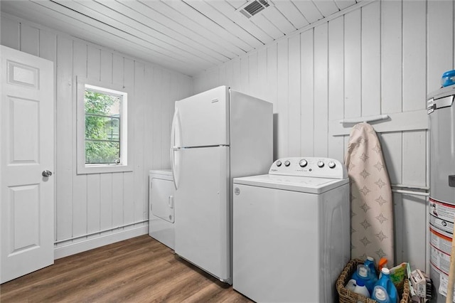 42 Lourando Dr W, Mobile, AL 36606 - washroom with washer and dryer, wood finished floors, gas water heater, and wooden walls