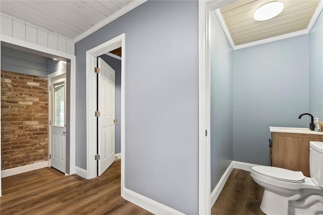 42 Lourando Dr W, Mobile, AL 36606 - bathroom featuring brick wall, crown molding, wood finished floors, and vanity