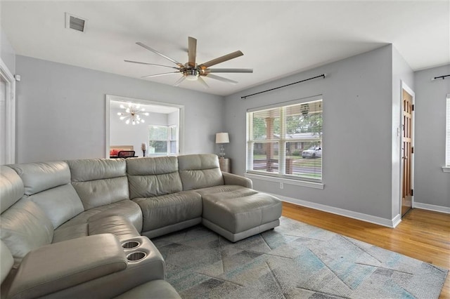 42 Lourando Dr W, Mobile, AL 36606 - living room featuring wood finished floors, ceiling fan, and a chandelier