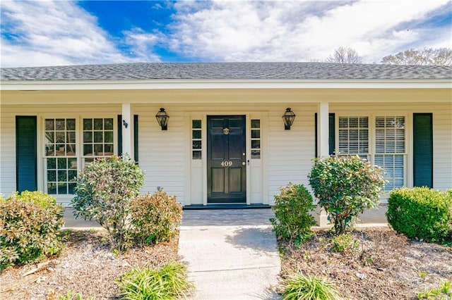 doorway to property with covered porch