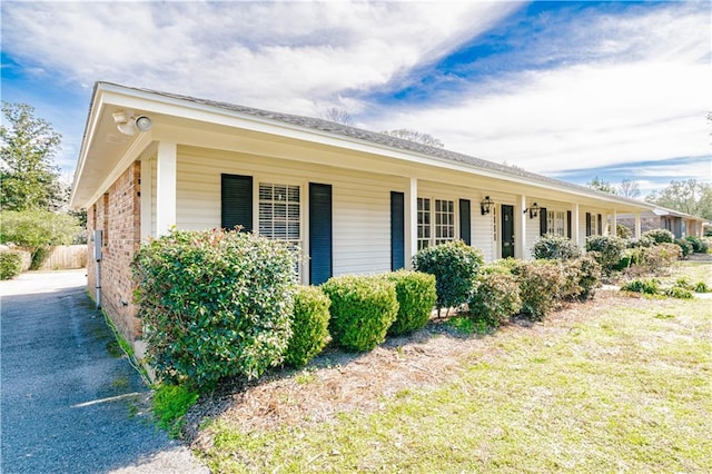 view of property exterior with covered porch