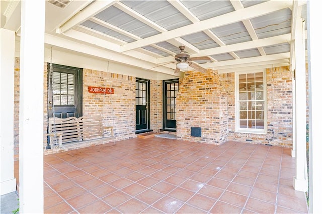 view of patio featuring ceiling fan