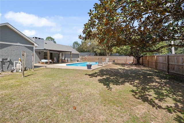 view of yard featuring a fenced in pool, a patio, and a fenced backyard