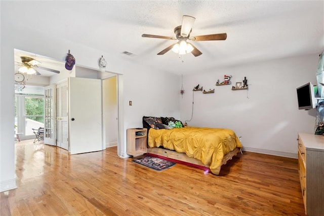 bedroom featuring hardwood / wood-style floors and ceiling fan