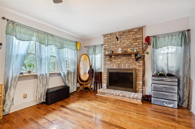 unfurnished room featuring a fireplace and hardwood / wood-style floors