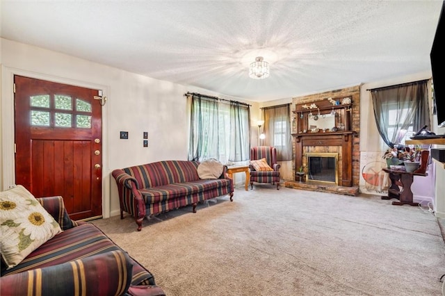 carpeted living room featuring a large fireplace