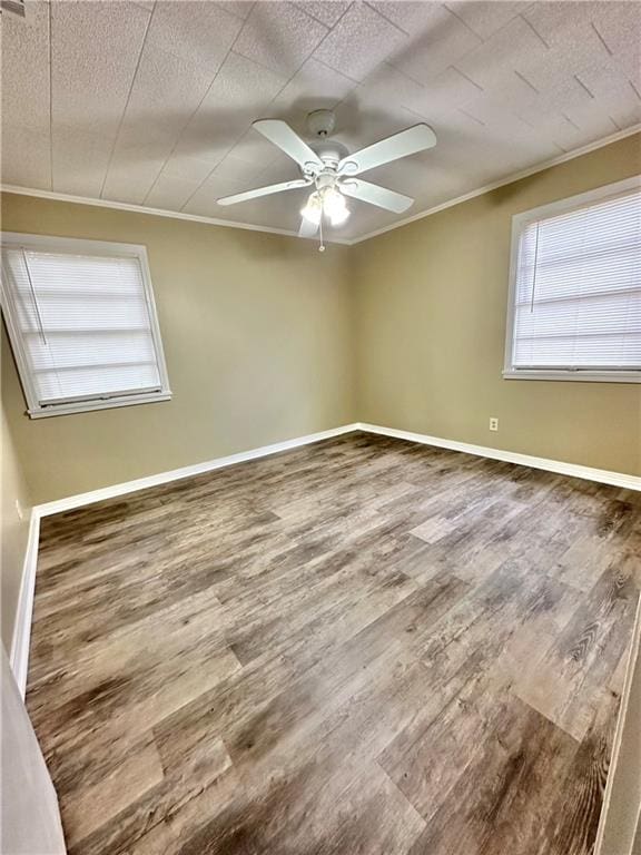 spare room with ceiling fan and hardwood / wood-style flooring