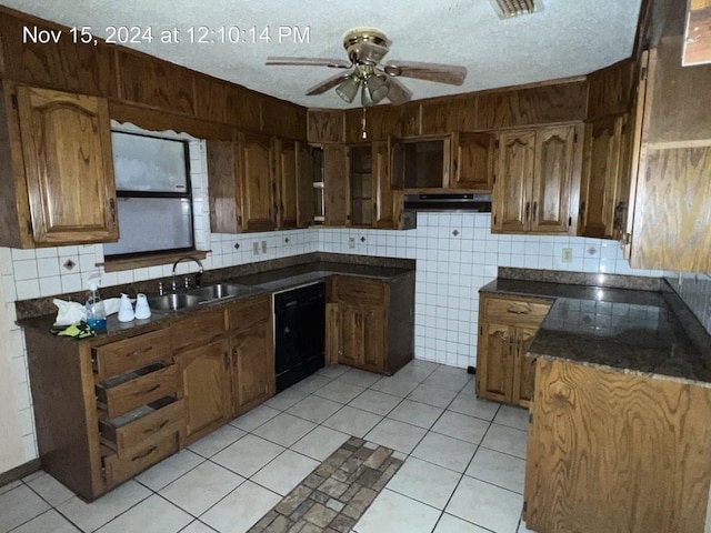 kitchen with exhaust hood, sink, ceiling fan, a textured ceiling, and black dishwasher