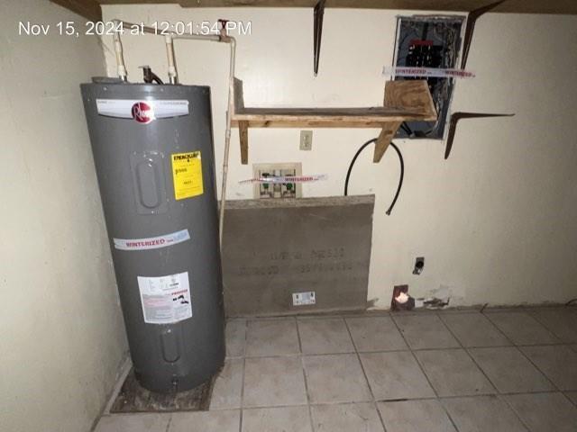 utility room featuring electric water heater