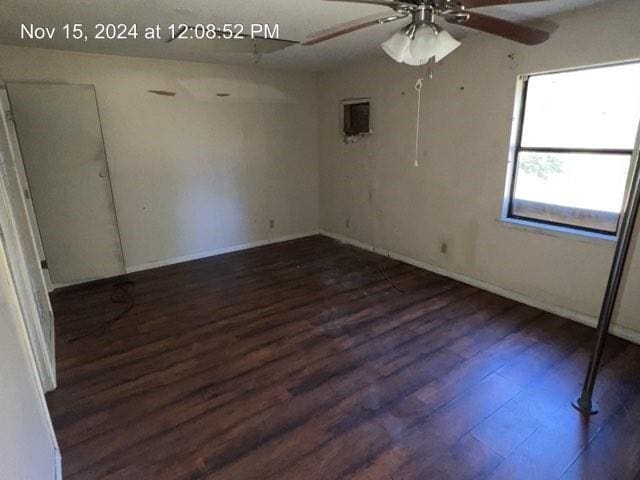 empty room featuring dark hardwood / wood-style floors and ceiling fan