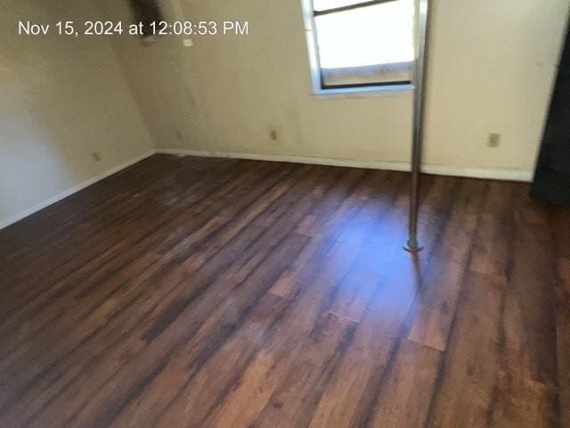 empty room featuring dark hardwood / wood-style floors