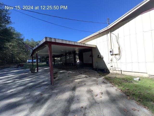 exterior space with a carport