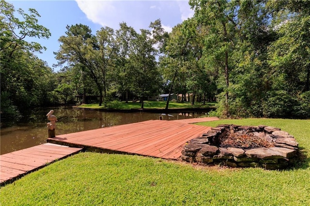 6659 Viking Way, Mobile, AL 36582 - wooden terrace with a lawn, a water view, a boat dock, and an outdoor fire pit