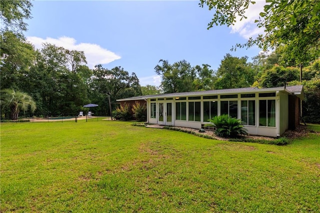6659 Viking Way, Mobile, AL 36582 - rear view of house with a sunroom