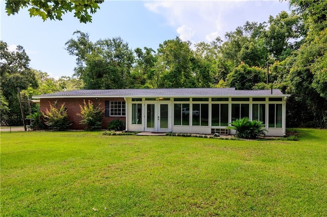 6659 Viking Way, Mobile, AL 36582 - rear view of house with french doors, a yard, a sunroom, and brick siding