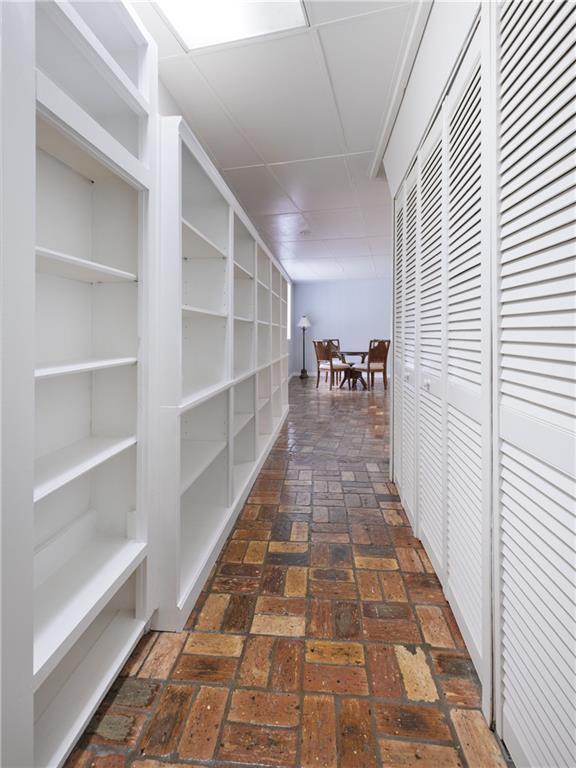 6659 Viking Way, Mobile, AL 36582 - corridor with brick floors