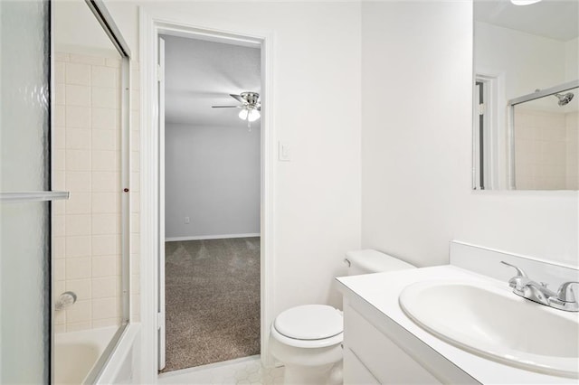 full bathroom with ceiling fan, vanity, toilet, and combined bath / shower with glass door