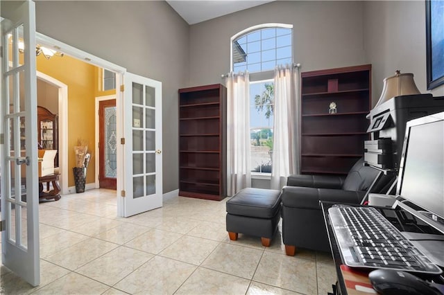 2765 Knollwood Dr, Mobile, AL 36693 - living area featuring french doors, a towering ceiling, tile patterned flooring, and baseboards
