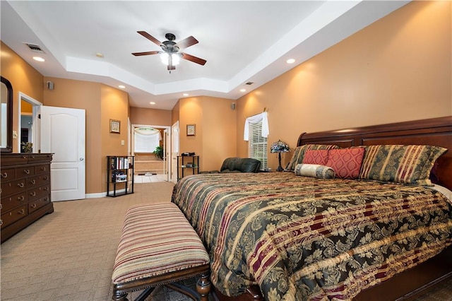 2765 Knollwood Dr, Mobile, AL 36693 - bedroom featuring a raised ceiling, light colored carpet, multiple windows, recessed lighting, and baseboards