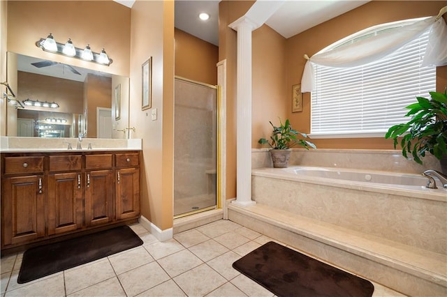 2765 Knollwood Dr, Mobile, AL 36693 - full bathroom featuring tile patterned flooring, a stall shower, vanity, a garden tub, and decorative columns