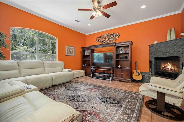 2765 Knollwood Dr, Mobile, AL 36693 - living room featuring ceiling fan, a glass covered fireplace, ornamental molding, recessed lighting, and tile patterned flooring