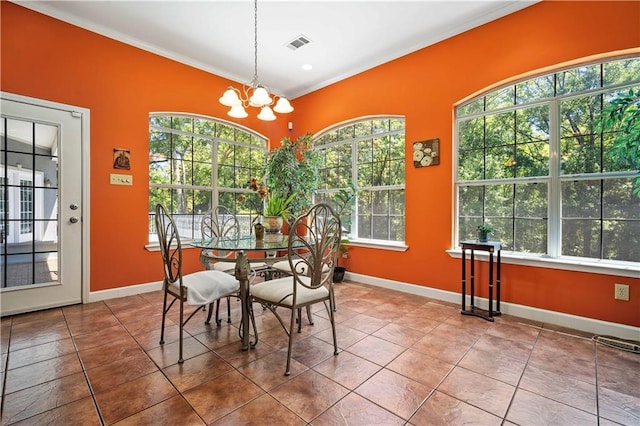 2765 Knollwood Dr, Mobile, AL 36693 - tiled dining area with crown molding, a chandelier, plenty of natural light, and baseboards