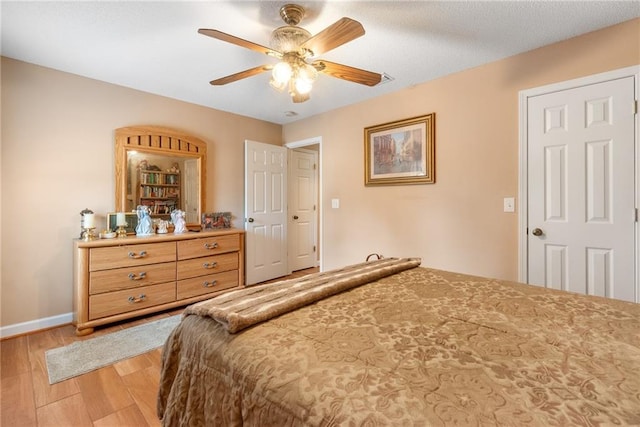 bedroom featuring ceiling fan and light wood-type flooring